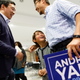 Yang talks with supporters.